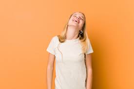 Cute and natural teenager woman relaxed and happy laughing, neck ...