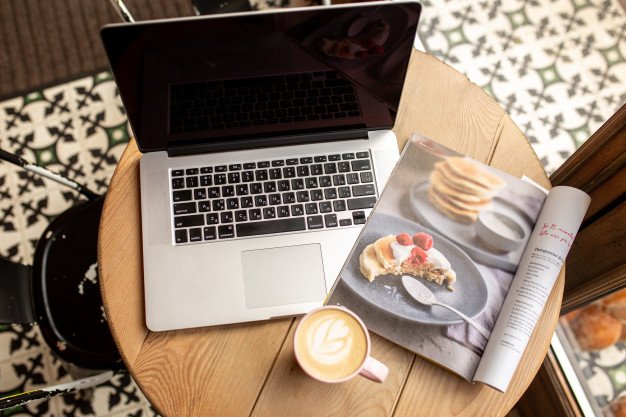 Laptop with a cup of coffee. work from home. work from a coffee shop. time  for yourself | Premium Photo